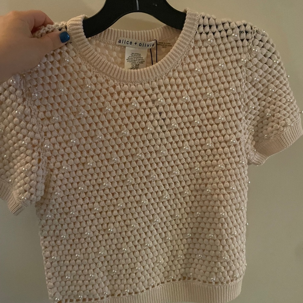 Knit top with faux pearl embellishments